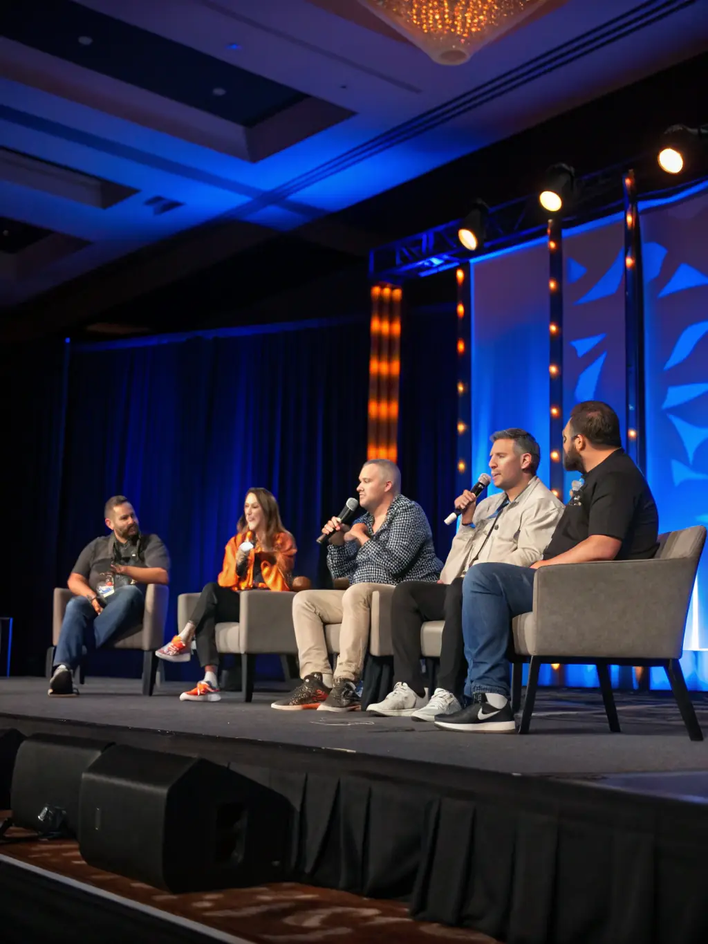 A photograph of a panel discussion at a business conference in Edinburgh, featuring industry experts discussing the challenges and opportunities in the UK tech sector.